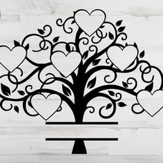 a tree with many hearts on it and the words love is in the air above it