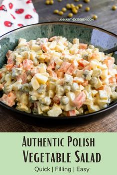 a bowl filled with potato salad on top of a wooden table