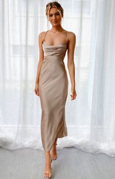 Mocha Cut Out Maxi Dress

How to style:
This stunning satin cut-out maxi dress is perfect for your next event, whether you're going to a wedding, 21st birthday or long lunch!


 
Features:
  
 * Thin adjustable shoulder straps 
 * Cowl neckline 
 * Padded bust 
 * Cut out at the waist 
 * Open back 
 * Invisible zip at the back 
 * Maxi length 
 * Unlined 
 * Thin satin-like material with minimal stretch  
This is the perfect formal dress for your next event! Cut Out Maxi Dress, Tan Dress, Cutout Maxi Dress, Guest Attire, Grey Maxi Dress, Long Bodycon Dress, Wedding Attire Guest, Beginning Boutique, Beige Dresses