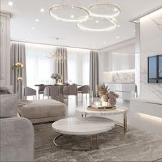 an elegant living room with white walls and marble furniture, including a round coffee table