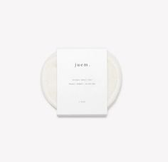 a white soap bar with the word jem on it in front of a white background