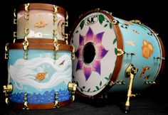 two colorfully painted drums sitting next to each other