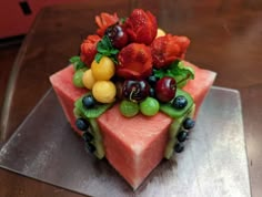 a piece of cake with fruit on top