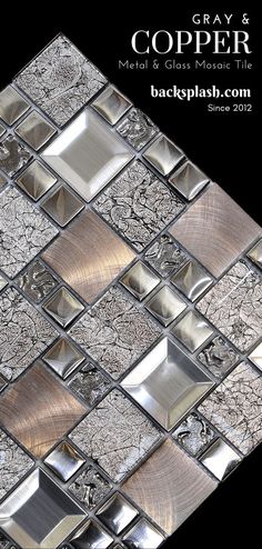 the back side of a glass mosaic tile backsplash with silver and black designs