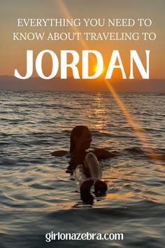 a woman swimming in the ocean at sunset with text overlay saying everything you need to know about traveling to jordan