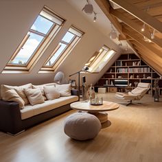 an attic living room with wooden floors and skylights above the couch, coffee table