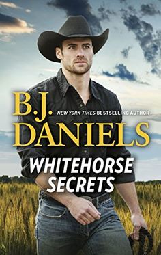 the cover of whitehorse secrets by b j daniels, with an image of a cowboy in