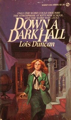 the cover to down in dark hall by lois duncan, with an image of a woman walking