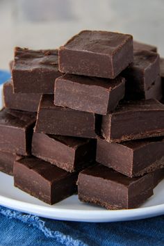 a pile of chocolate fudges on a white plate