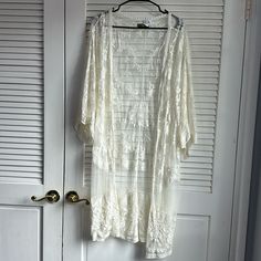 This Is A Lace Transparent Cardigan That Goes Down To The Knees. It's Very Delicate And Flowy And Gives Me Cottagecore Vibes. It's Very Elegant. Size: Xl Condition: Used A Few Times Lace Long Cardigan Floral Transparent Cardigan, Lace Cardigan Aesthetic, White Sheer Cardigan, Muffin Costume, Cream Long Sleeve Cardigan With Crochet Lace, Long Sheer Cardigan, Fairy Cardigan, Cream Long Sleeve Crochet Lace Cardigan, White Lace Cardigan