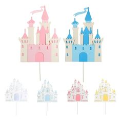 a set of four cake toppers with castle designs on them, all in pastel colors