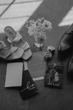 black and white photograph of wedding items on the floor