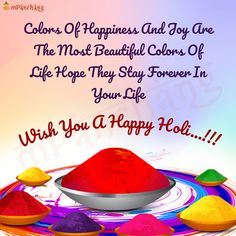 happy holi day wishes with colorful powders on the plate and rainbow colors in the bowl