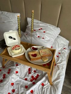 two pieces of cake on a tray with candles