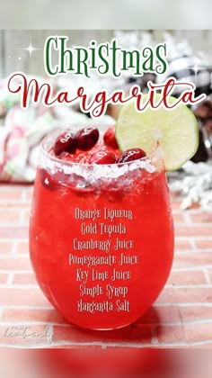 a red drink with lime and cranberries in it on the cover of christmas margarita