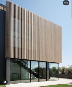 a modern building with grass in front of it