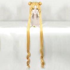 a wig with long blonde hair and horns on it's head is shown in front of a white background