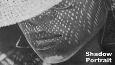 a black and white photo of a woman wearing a hat with the words shadow portrait on it