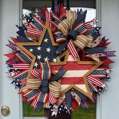 a patriotic wreath with stars and stripes on the front door