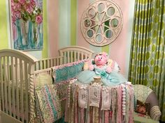 a baby crib with a teddy bear sitting on top of it