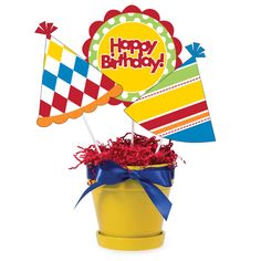 a birthday card in a bucket with flags and streamers