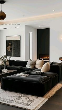 a living room filled with furniture and a fire place in the middle of the room