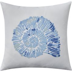 a blue and white pillow with an abstract design on it