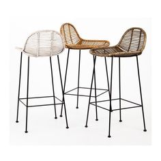 two wicker bar stools sitting next to each other on top of a white floor