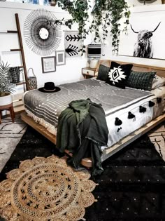 a bed room with a neatly made bed and plants hanging on the wall above it