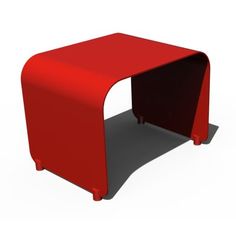 a red table sitting on top of a white floor