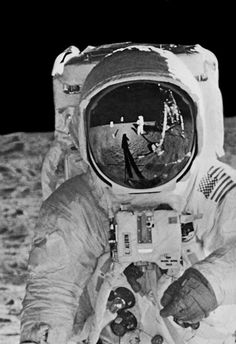 an astronaut is sitting on the moon with his feet propped up in front of him