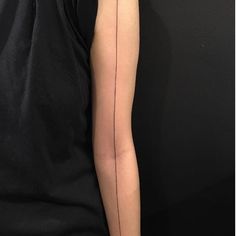 a person with a tattoo on their arm and the other arm has a line drawn across it