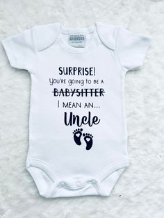 a baby bodysuit that says, surprise you're going to be a babysither i mean an uncle