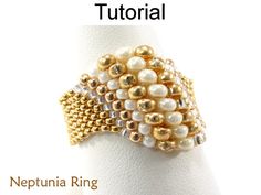 an image of a ring with pearls on the front and back of it's band