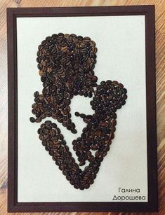 coffee beans are arranged in the shape of a woman's head