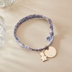 A perfect reminder of unconditional love to treasure. Our Personalized Mommy Liberty Bracelet combines heartfelt charms to represent little ones with the iconic prints of Liberty. Choose between five eye-catching patterns to pair with a smooth disc featuring unforgettable names or dates, and your choice of mini girl &amp; boy charms to match.&nbsp;18K Champagne Gold Plated, 925 Sterling Silver or 18K Rose Gold PlatedCharms measure: 0.6 x 0.6 (Small Flat Disc), 0.5 x 0.3 (Mini Girl, Mini Liberty Bracelet, Iconic Prints, Small Flat, Sliding Knot, Unconditional Love, Champagne Gold, Hand Engraving, 18k Rose Gold, Rose Gold Plates