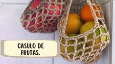 two bags filled with fruit sitting on top of a white tile floor next to each other