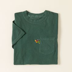 Whether you’re hitting the trail for real or just daydreaming about heading out for a hike, this tee has got you covered. Kate Shomaker embellishes her crewneck with a miniature hiker trekking up the side of the chest pocket, walking poles and all-a sweet and subtle way to share your passion for the outdoors. | Hiker's Haven Pocket Tee - Small | Personalized T-Shirts & Sweatshirts for Him: Custom Fashion Embroidered Shirt Men, Walking Poles, Graphic Shirt Design, Getting Outside, Streetwear Inspo, Dope Fits, Entertaining Gifts, Dog Fashion, Gifts For Anyone