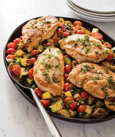 chicken and veggies in a skillet with a fork on the side, ready to be eaten