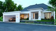 a car is parked in front of a house with two garages on the street