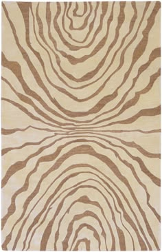 an animal print rug with brown and white stripes