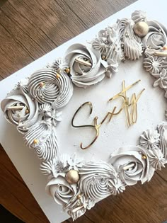 a white card with gold foiling and the word spf spelled out in cursive writing