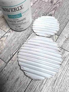 white paint sitting on top of a wooden floor