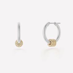 The Ara Deux Hoop Earrings are the definition of a luxurious, elevated staple. Comprised of medium-sized, tubular hoops in either .925 sterling silver or 18k yellow gold anchored by pure 18k white gold posts, the Ara Deux Hoop Earrings feature three floating annulets of 18k yellow gold. The outermost annulet is adorned by contrasting, front-facing, pave-set white diamonds. Stone Ornaments, Luxury Jewelry Brands, Shimmer Shine, Luxury Earrings, Sterling Silver Hoops, Gold Diamond Rings, Fine Jewellery Earrings, Gold Hoops, Silver Hoops