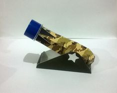 an origami knife with camouflage print on it