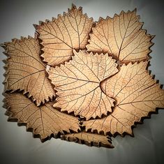 four leaf shaped plates sitting on top of a table