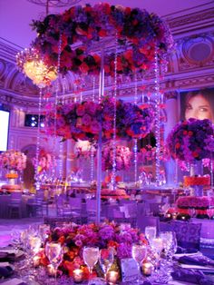 an elaborate table setting with flowers and candles