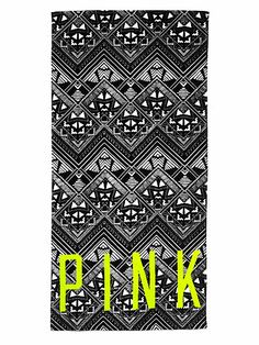 a black and white towel with the word pink in neon yellow on it's front