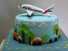 a birthday cake with a plane on top