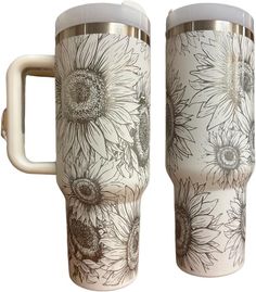 two white coffee mugs with sunflower designs on them